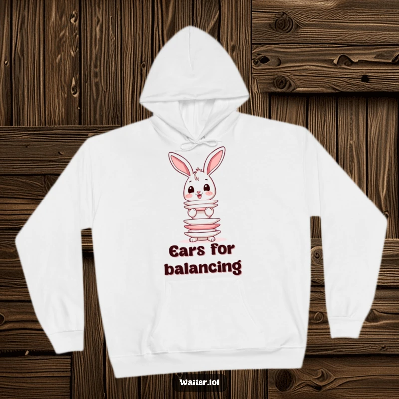 Funny hoodie illustration of a happy bunny with wobbly ears trying to balance an impossibly tall stack of plates.