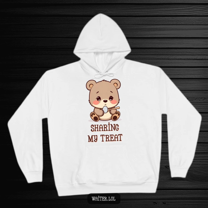 Funny hoodie with a shy bear cub shyly offering a tiny spoon with a hopeful expression, providing cozy comfort and heartwarming charm.